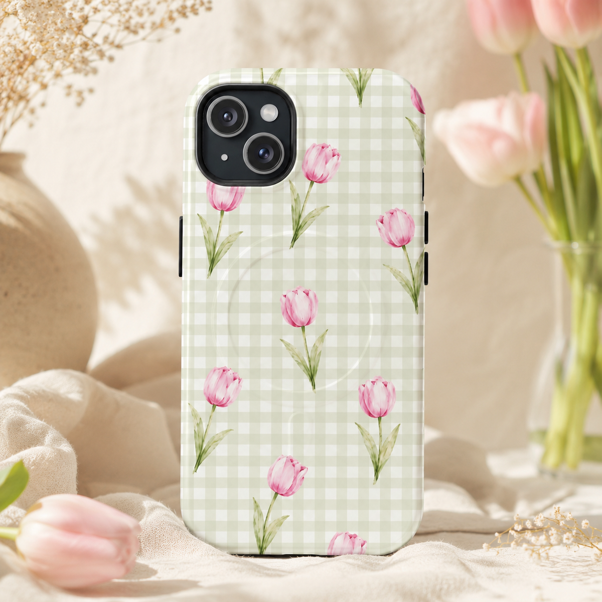 Pink Tulip Gingham magnetic phone case in a pink floral setting