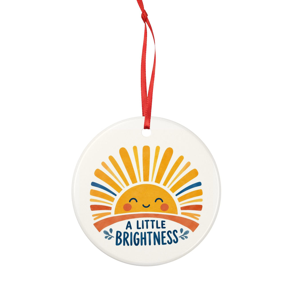 Round ceramic hanging ornament showing smiling golden sun and blue A Little Brightness lettering.