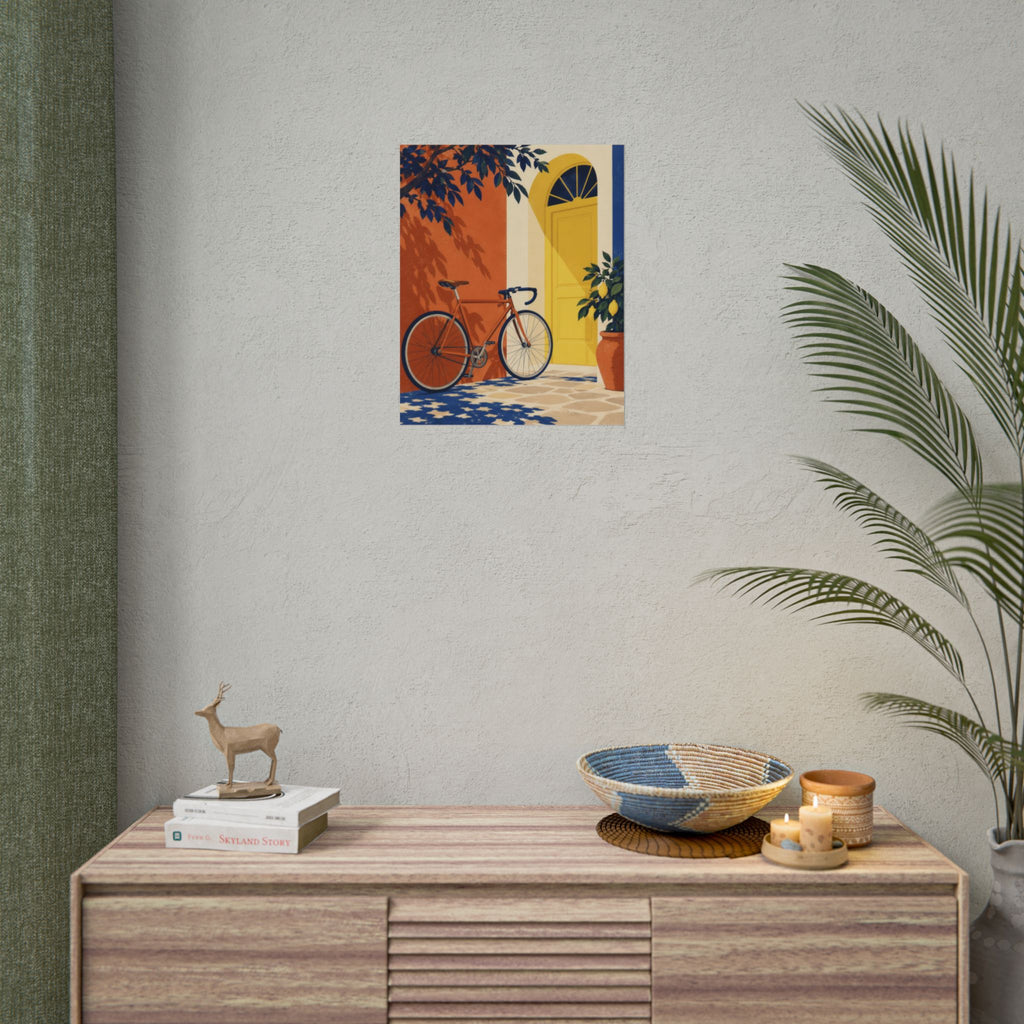 Pedal & Pause art print by Cozy Prints UK: bicycle beside a yellow doorway, terracotta wall and leafy plants.