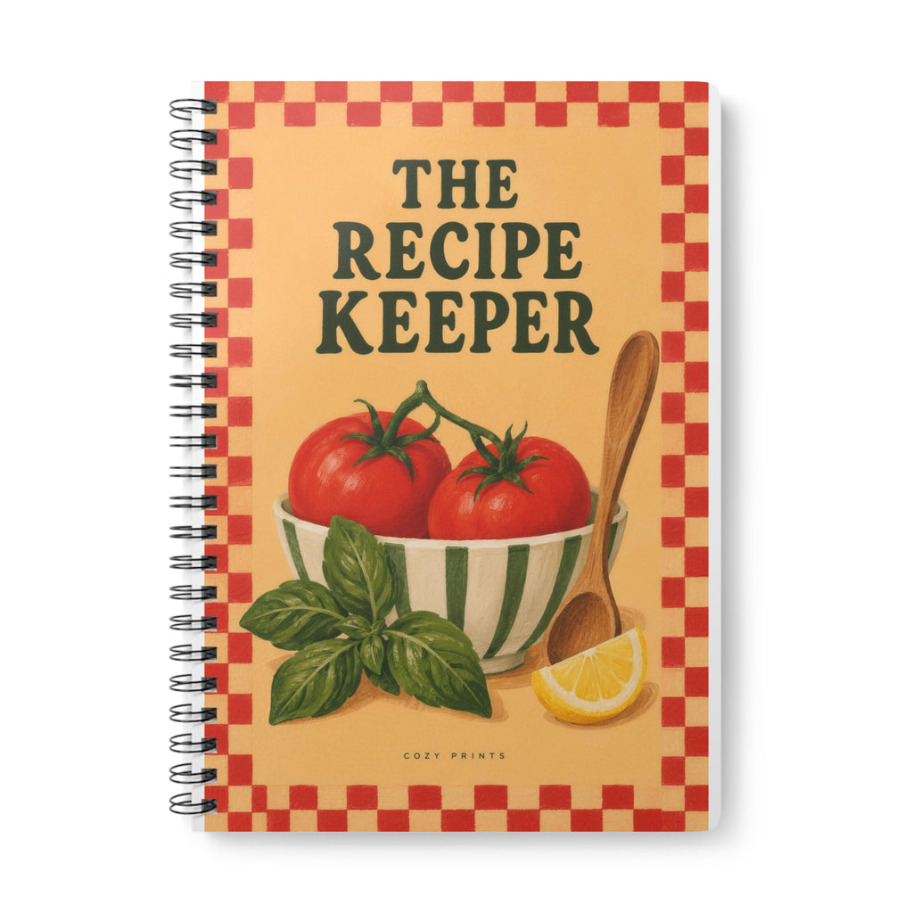 The Recipe Keeper A5 notebook by Cozy Prints UK: tomato-and-basil illustration, checkerboard border and “THE RECIPE KEEPER” lettering.