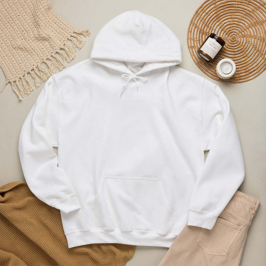 White hoodie laid flat with neutral accessories