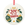 Round ceramic hanging ornament showing green patterned mittens with red Joy by the Handful lettering and holly.
