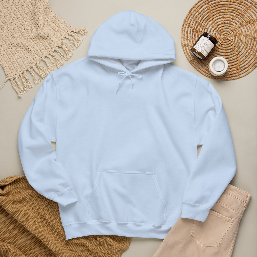 Light blue hoodie laid flat with neutral accessories