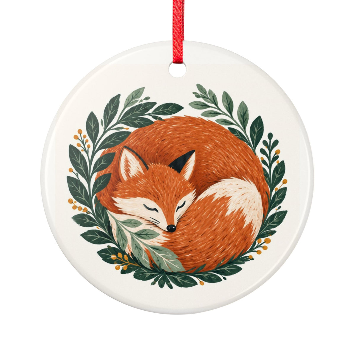 Round ceramic hanging ornament showing sleeping russet fox curled among green woodland leaves.