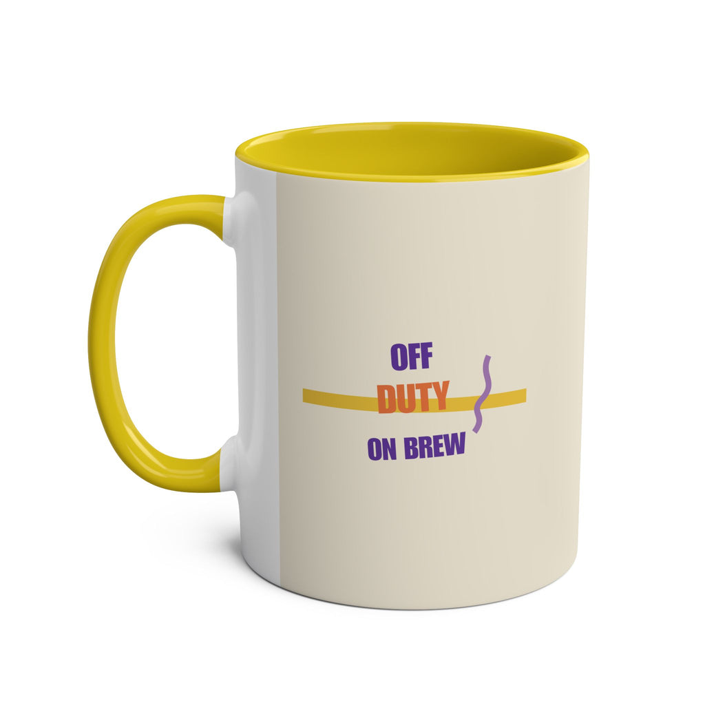 11oz mug with yellow handle and interior, showing purple and orange off duty on brew lettering on cream with a stripe and steam squiggle