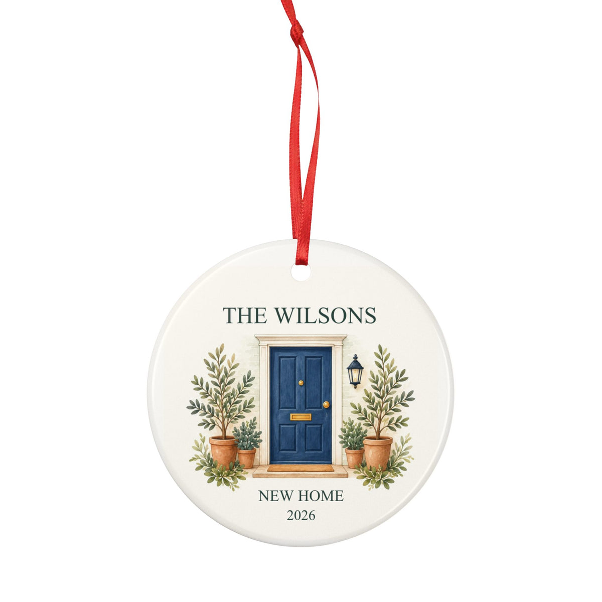 Round ceramic hanging ornament showing navy front door with plants, the sample family name The Wilsons and New Home wording.