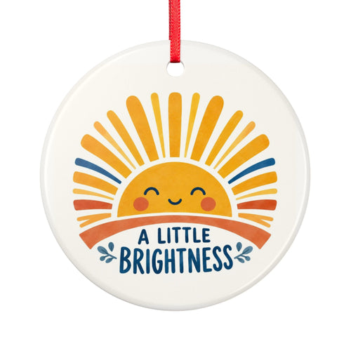 Round ceramic hanging ornament showing smiling golden sun and blue A Little Brightness lettering.