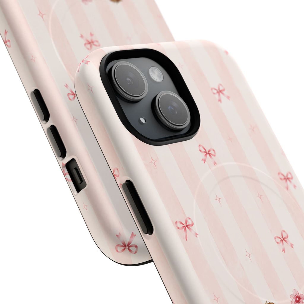 Angled close-up of the Dachshund and Flowers case showing pink stripes, tiny bows and a two-camera surround.