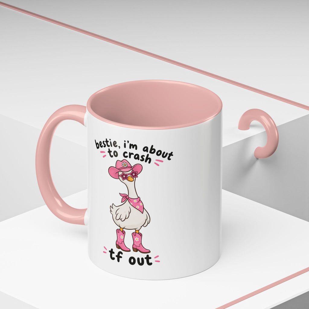 Pink Crash Out goose mug on a geometric display
