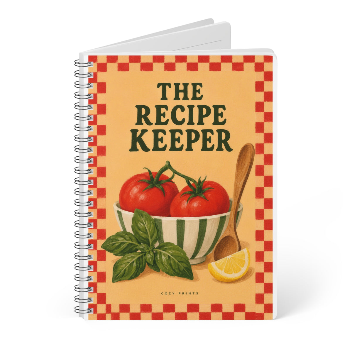 Angled view of The Recipe Keeper A5 notebook by Cozy Prints UK, showing the illustrated front cover and black wire binding.