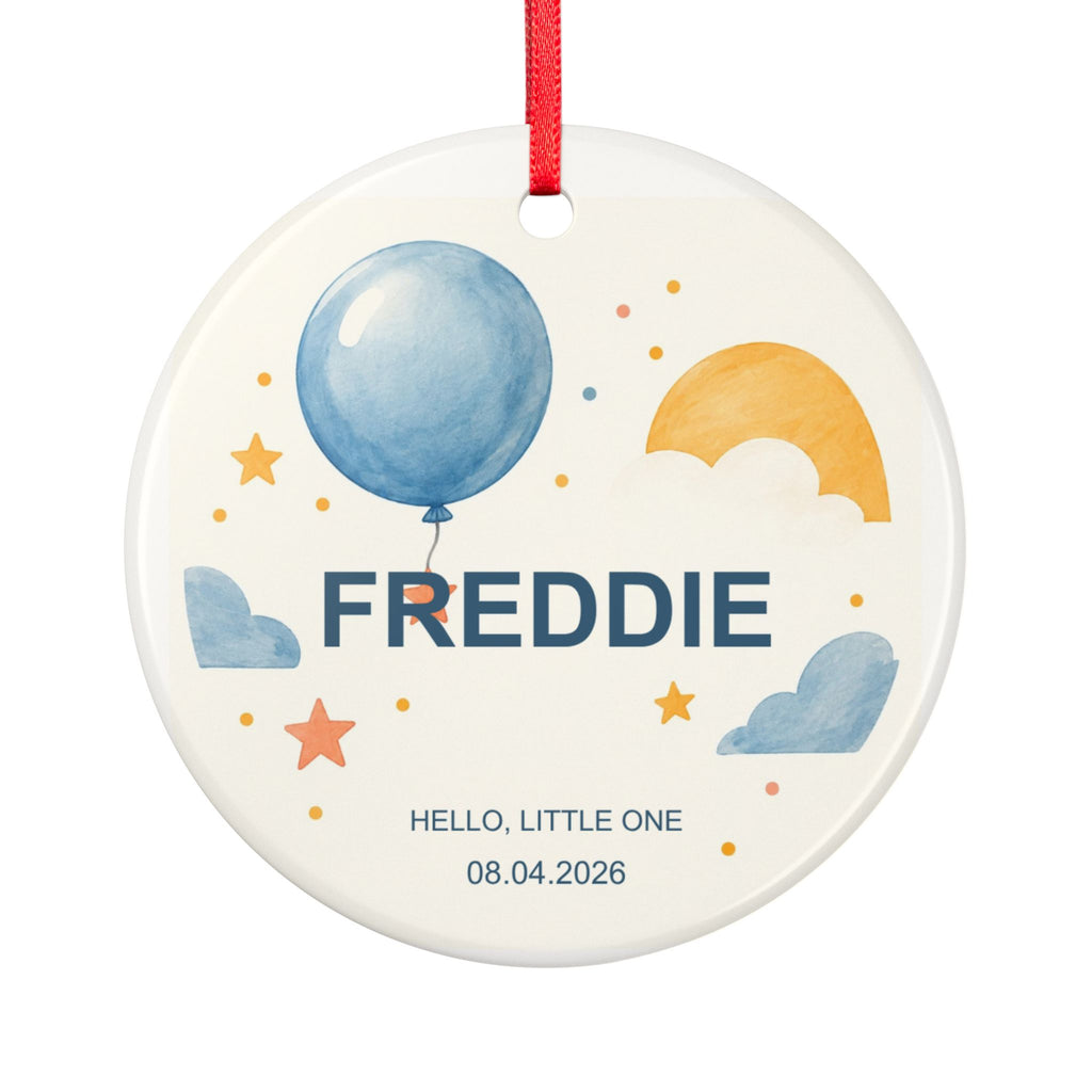 Round ceramic hanging ornament showing blue balloon, yellow sun and stars with the sample name Freddie and sample birth date.