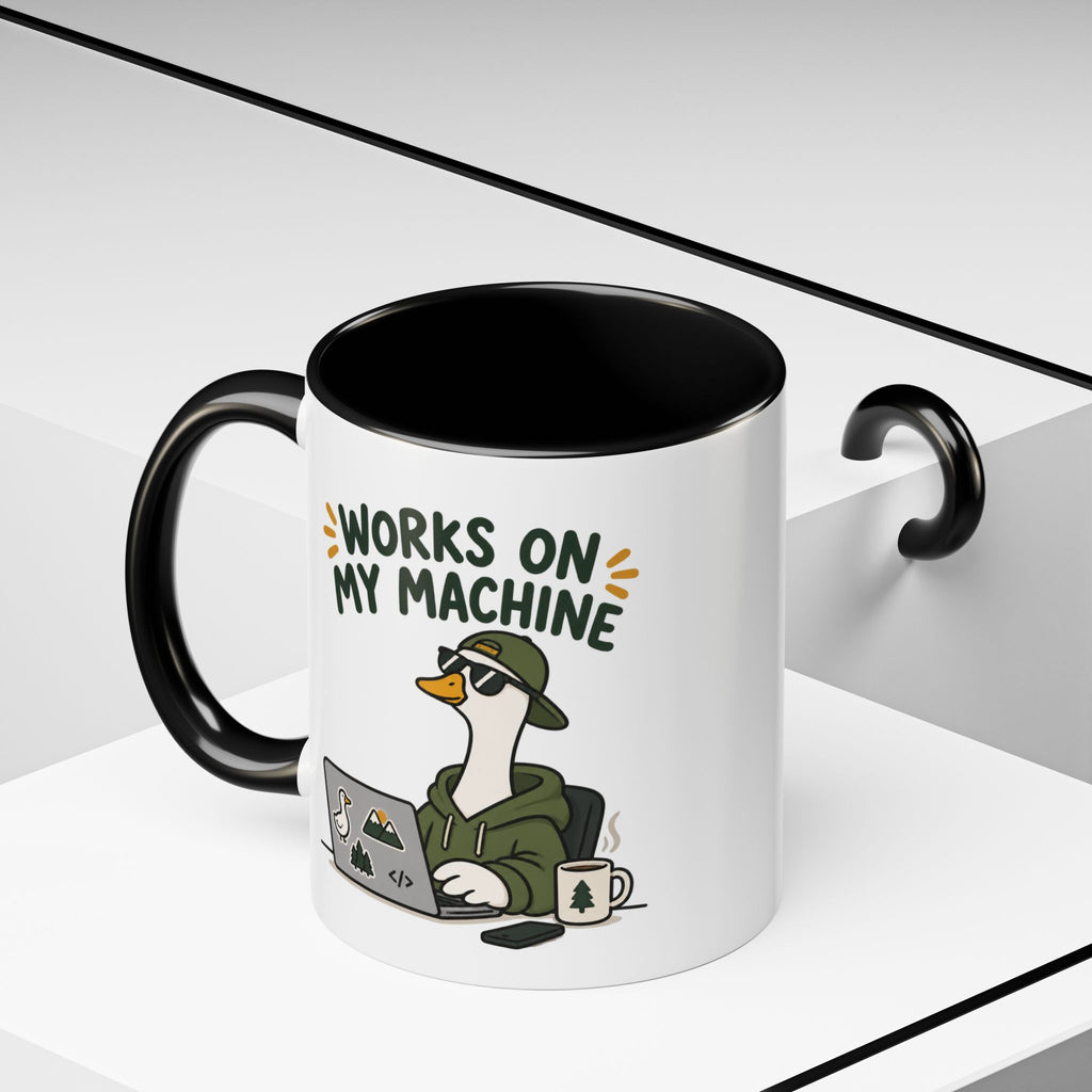 Black Works on My Machine goose mug on a geometric display