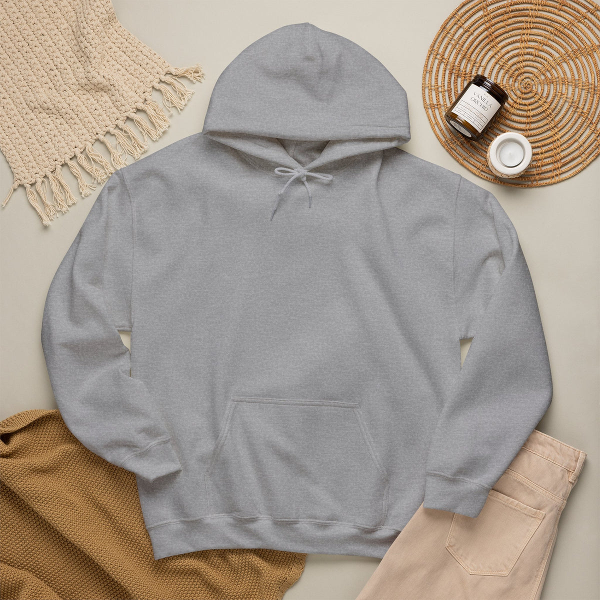Sport grey hoodie laid flat with neutral accessories
