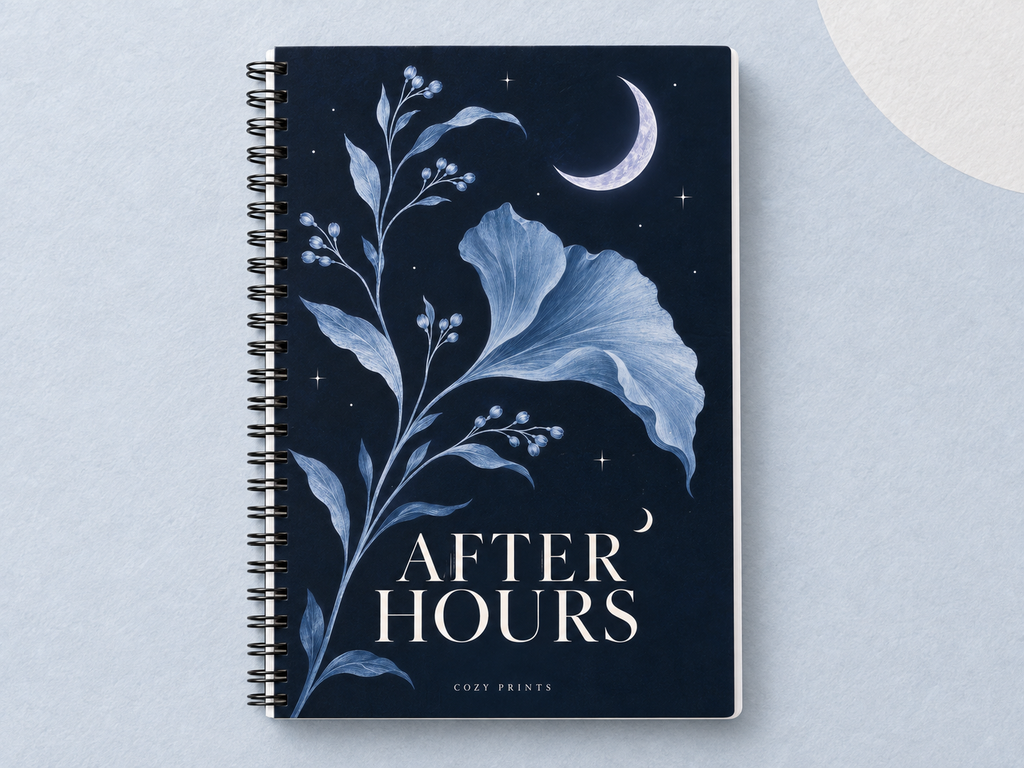 After Hours A5 wirebound notebook with a navy botanical cover and crescent moon on a pale silver-blue backdrop.