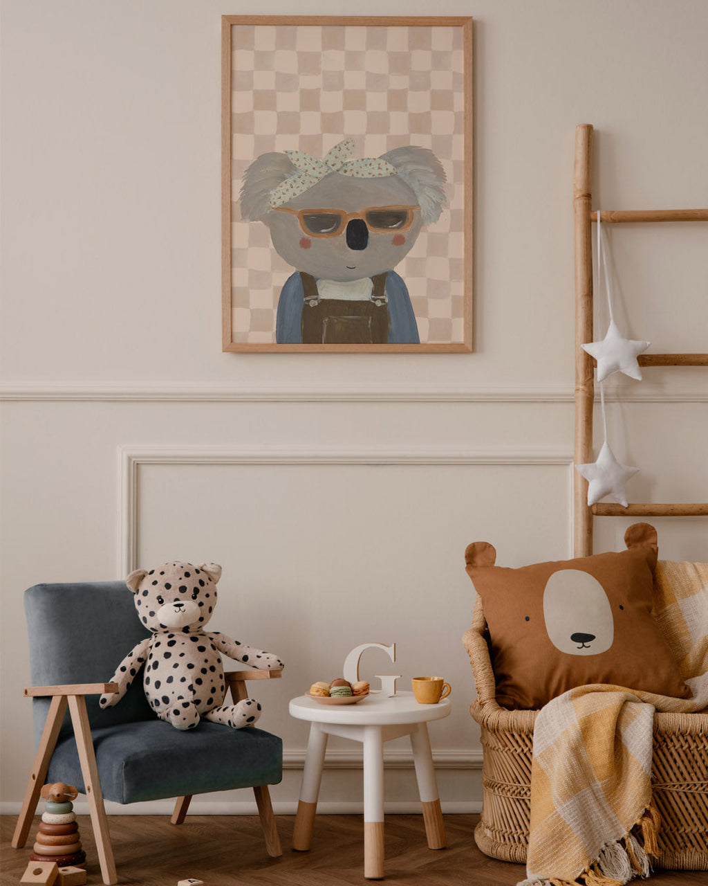 Bring Me Sunshine koala print above a children's reading corner with a toy leopard, small table and bear cushion.