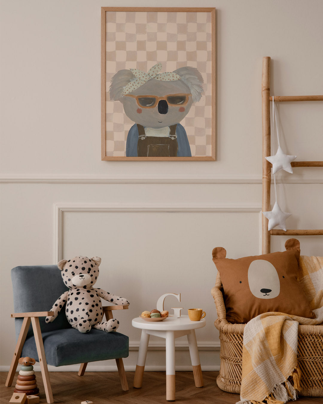 Bring Me Sunshine koala print above a children's reading corner with a toy leopard, small table and bear cushion.