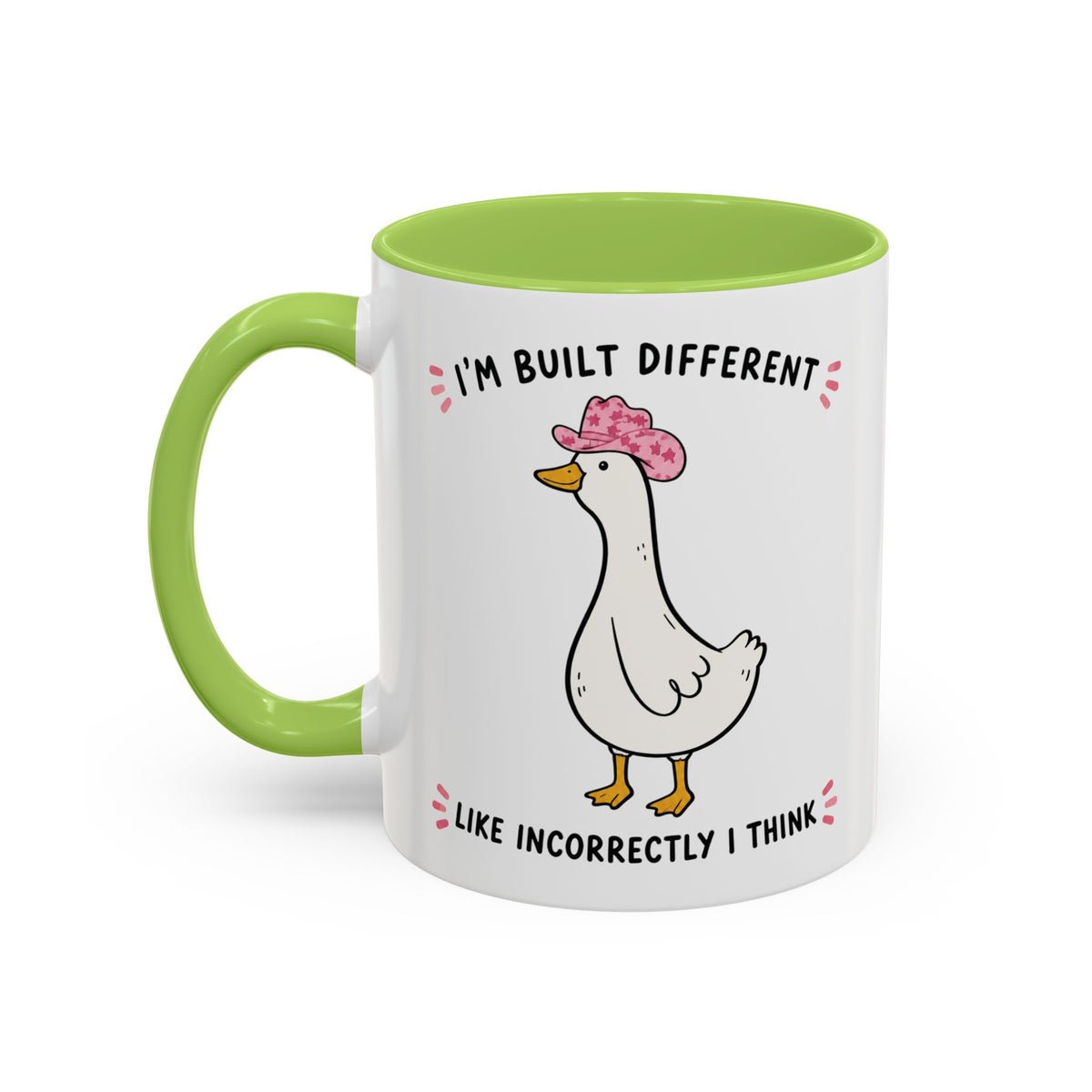 Front view of the light green Built Different duck accent mug